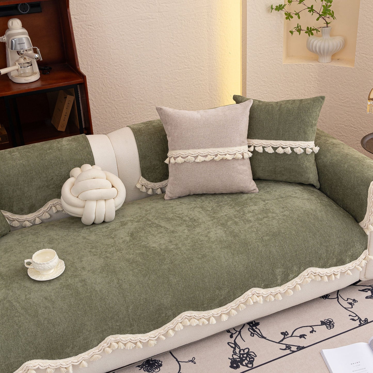 Chenille Sofa Cover Towel – Non-Slip, Washable Pets Couch Protector with Tassels on a green couch with decorative cushions.