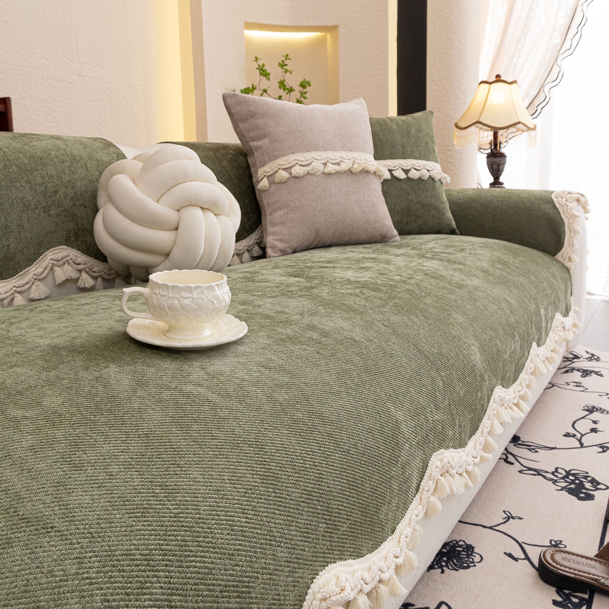 Chenille Sofa Cover Towel – Non-Slip, Washable Pets Couch Protector with Tassels on a sofa with decorative cushions.