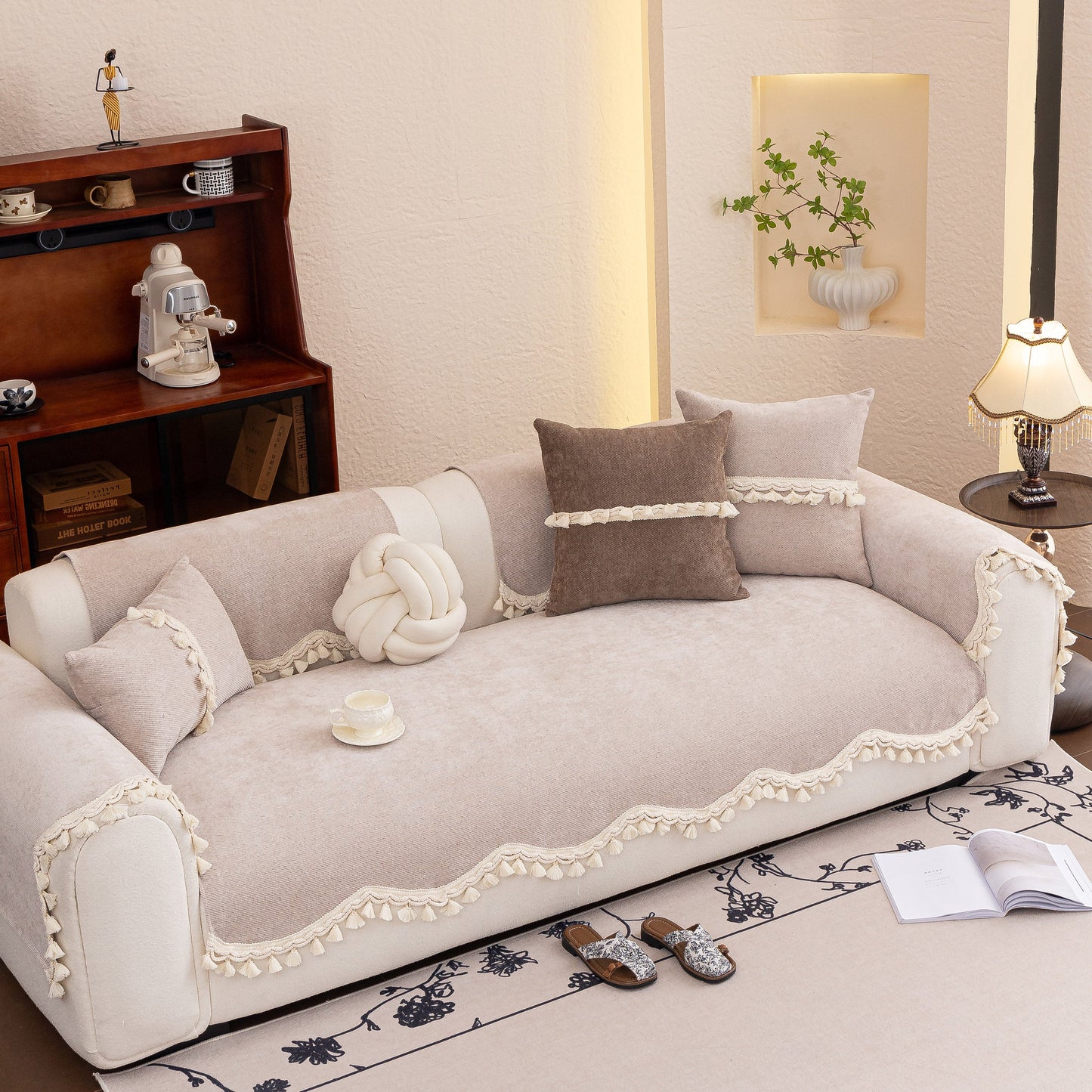 Chenille Sofa Cover Towel – Non-Slip, Washable Pets Couch Protector with Tassels on a beige sofa in an elegant living room.