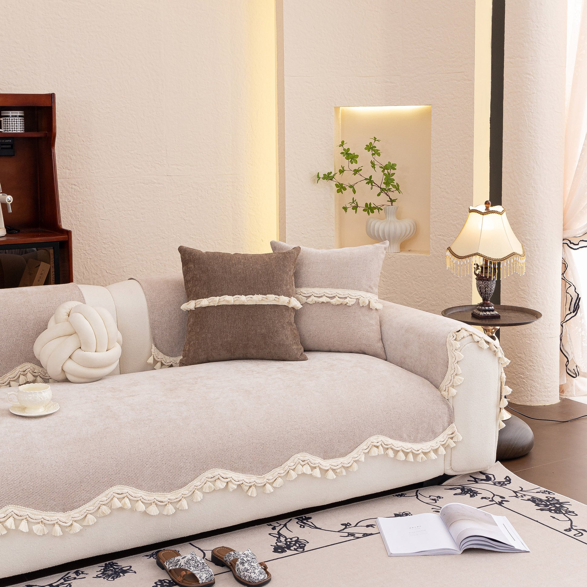Chenille Sofa Cover Towel – Non-Slip, Washable Pets Couch Protector with Tassels on elegant beige sofa