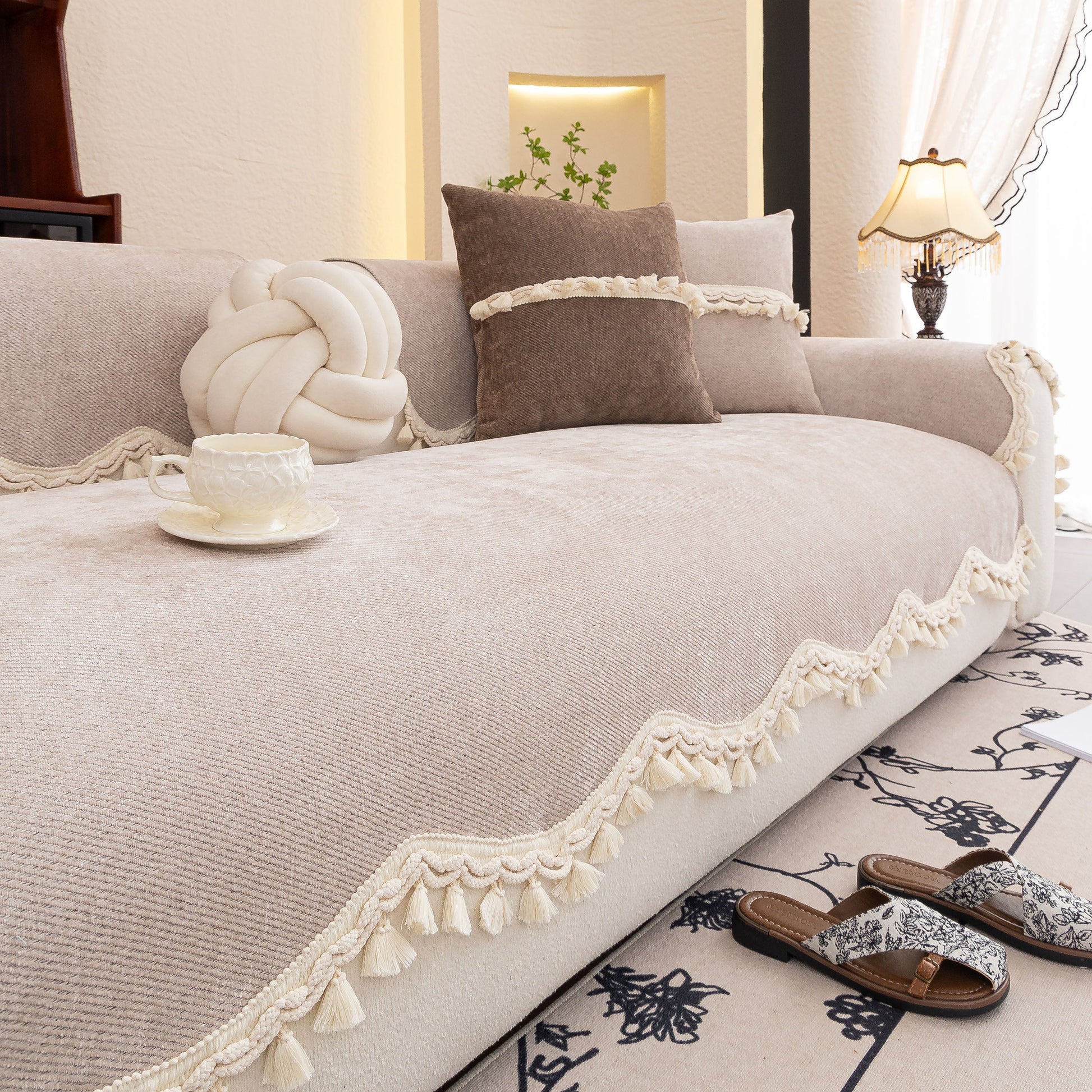 Chenille Sofa Cover Towel – Non-Slip, Washable Pets Couch Protector with Tassels; elegant chenille fabric with tassels on a sofa.