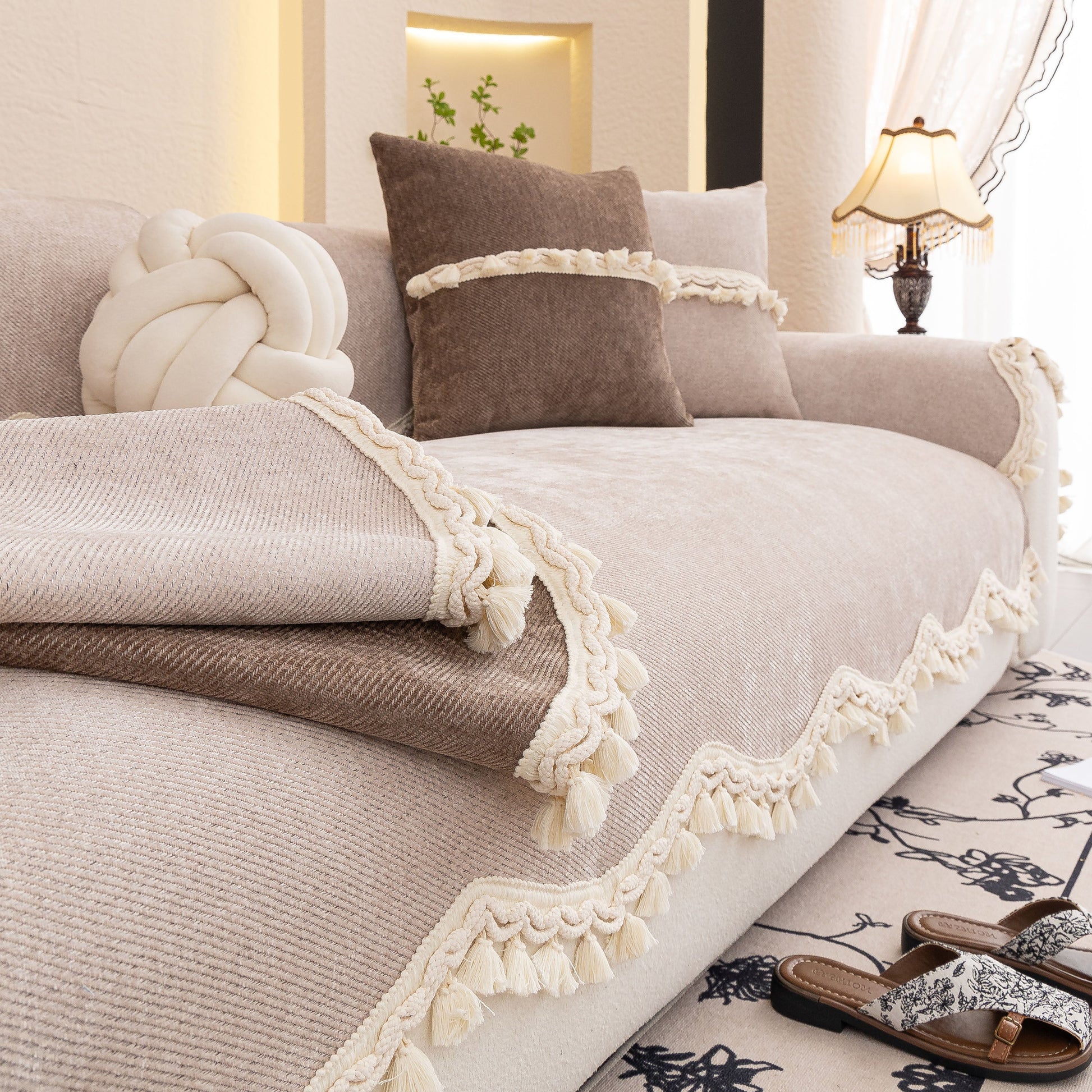 Chenille Sofa Cover Towel – Non-Slip, Washable Pets Couch Protector with Tassels and braided trim in elegant living room setting.