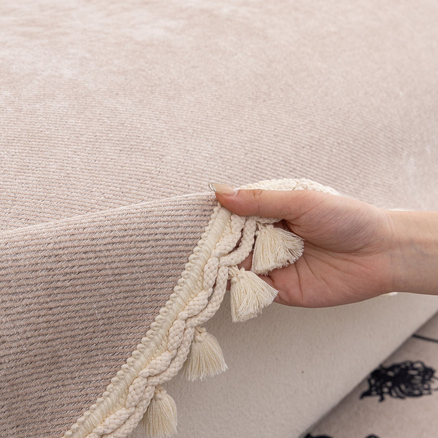 Hand adjusting Chenille Sofa Cover Towel – Non-Slip, Washable Pets Couch Protector with Tassels featuring ivory braided trim.