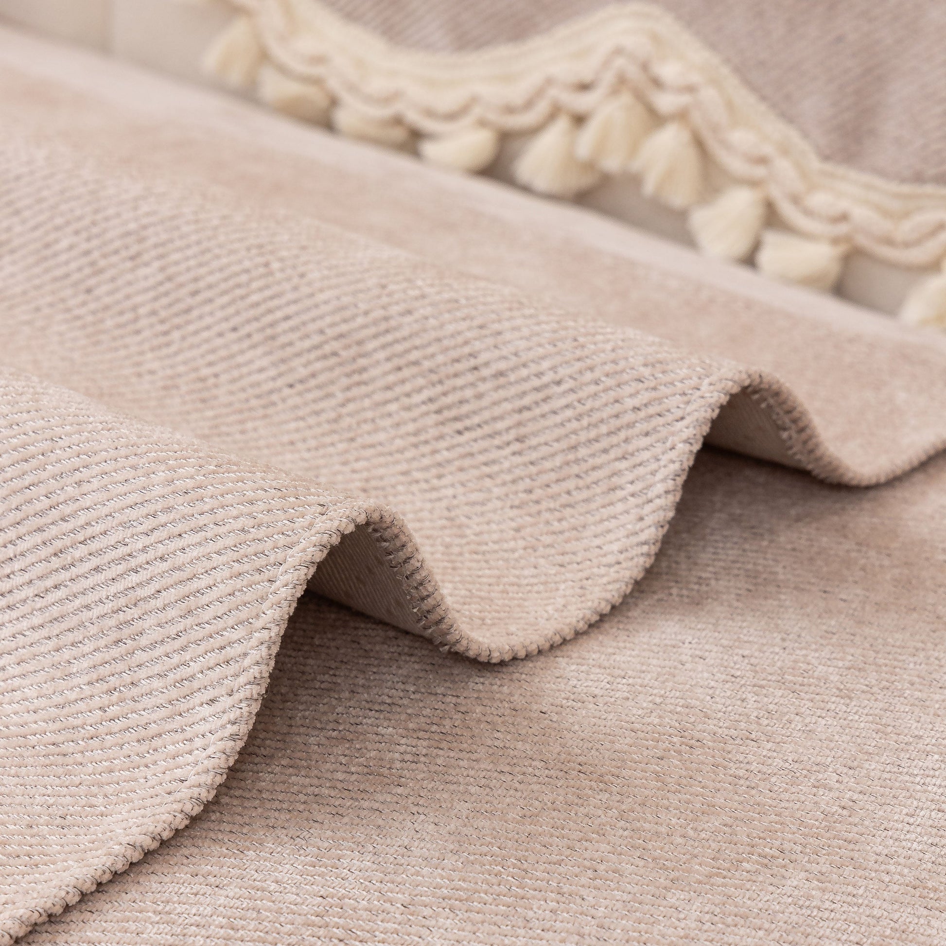 Chenille Sofa Cover Towel – Non-Slip, Washable Pets Couch Protector with Tassels displayed with ivory braided trim and tassels.