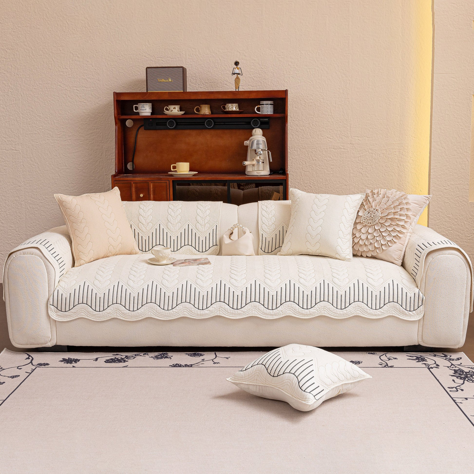 Living room with 3D Quilted Thick Cotton Sofa Cover Non-Slip Couch Throw for Fabric & Leather Sofas on a beige couch.