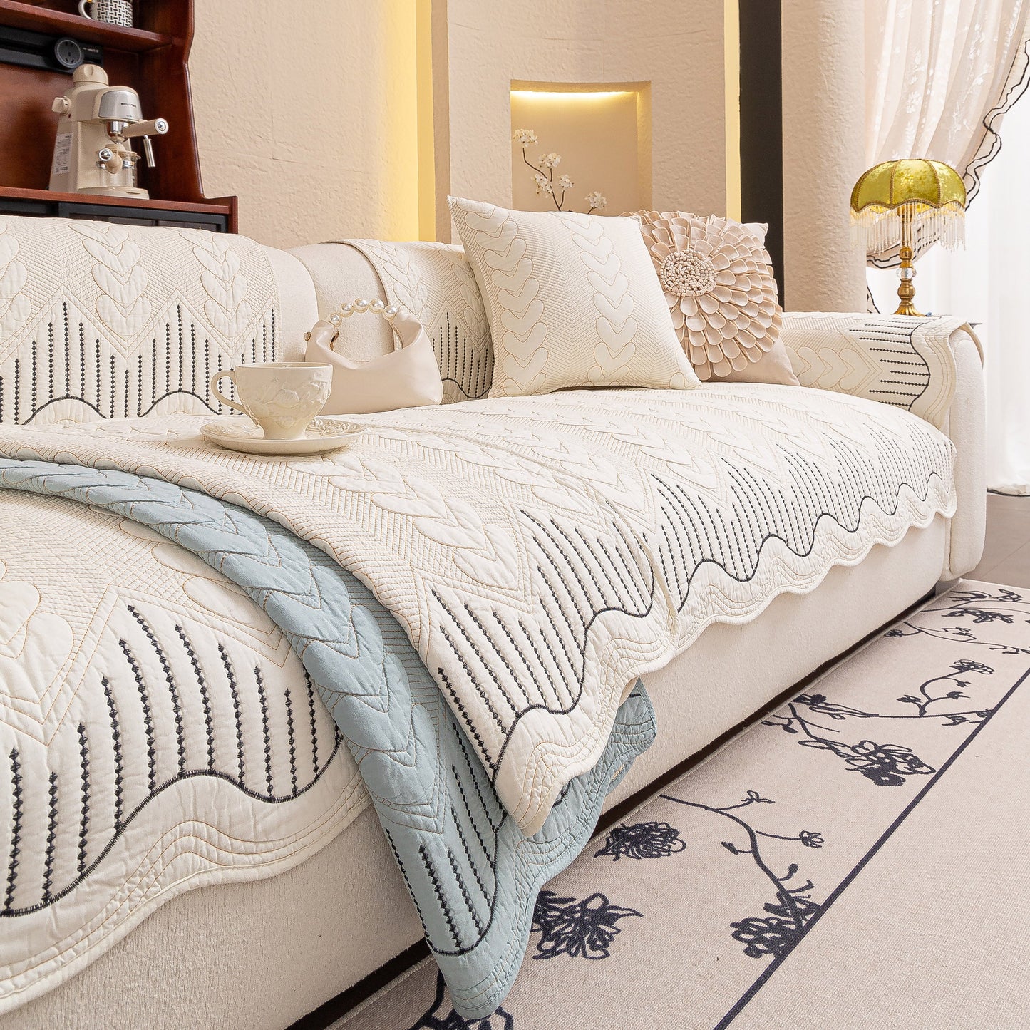 Living room with a 3D Quilted Thick Cotton Sofa Cover Non-Slip Couch Throw for Fabric & Leather Sofas, elegant and comfortable setting.
