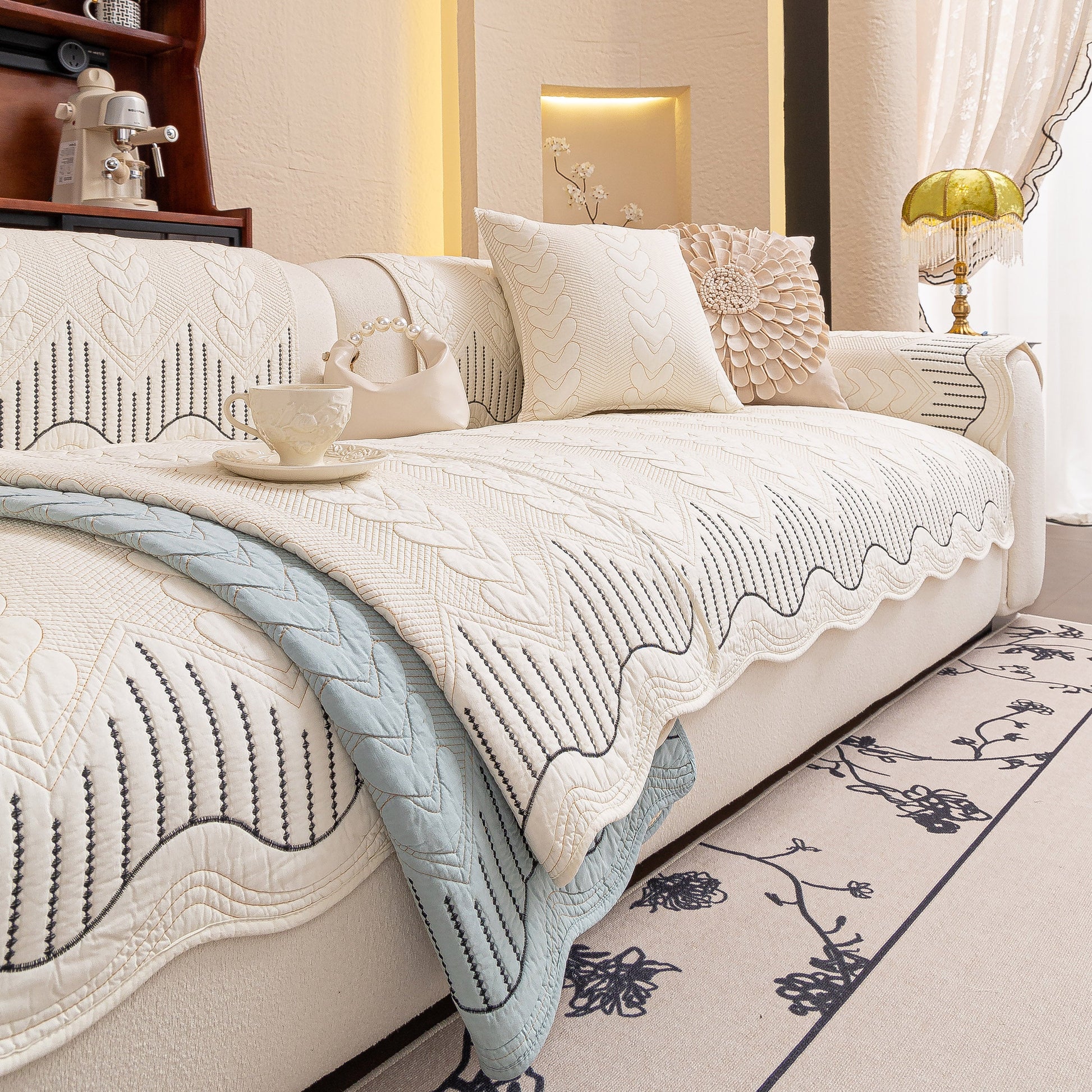 Living room with a 3D Quilted Thick Cotton Sofa Cover Non-Slip Couch Throw for Fabric & Leather Sofas, elegant and comfortable setting.