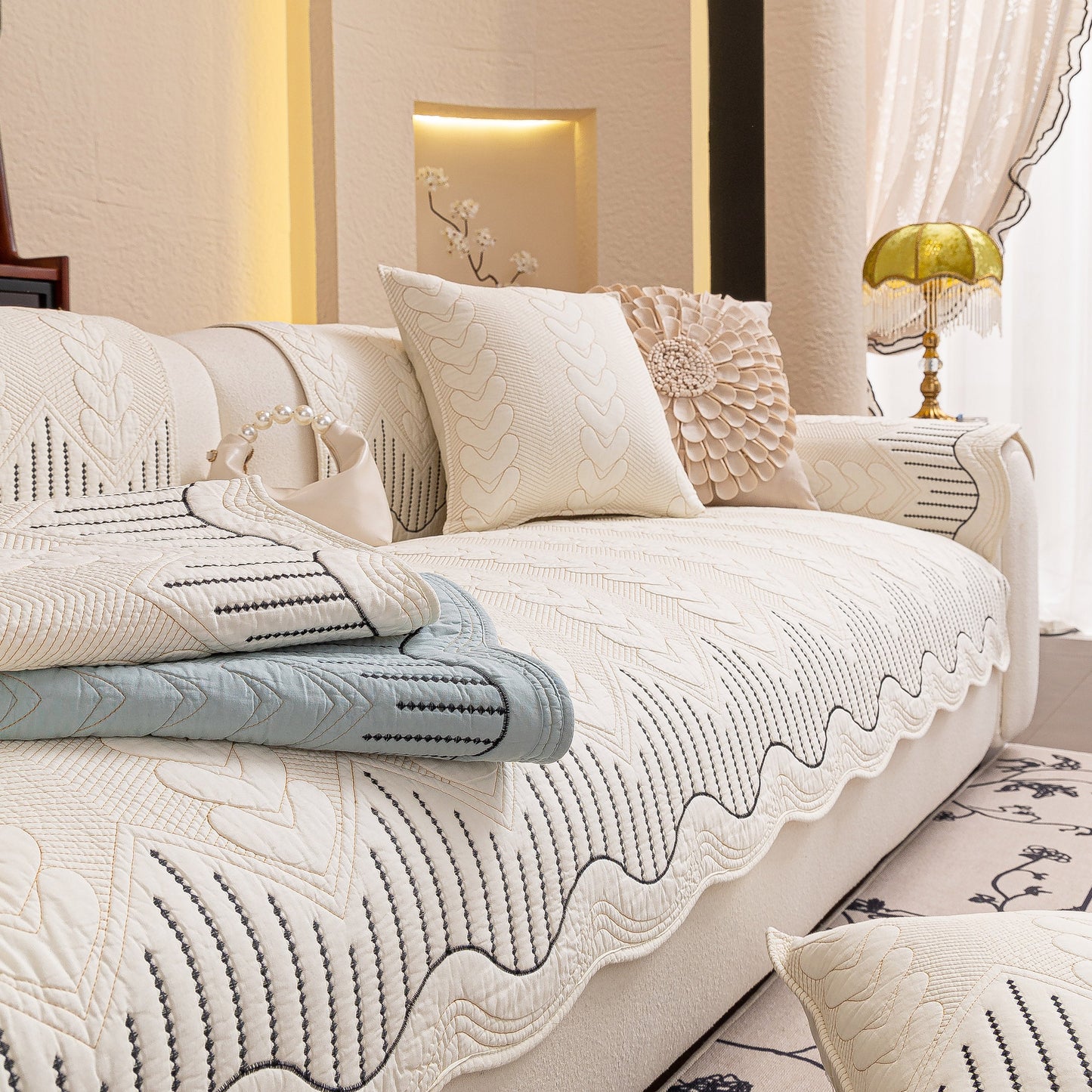 3D Quilted Thick Cotton Sofa Cover Non-Slip Couch Throw for Fabric & Leather Sofas displayed on a luxurious white couch.
