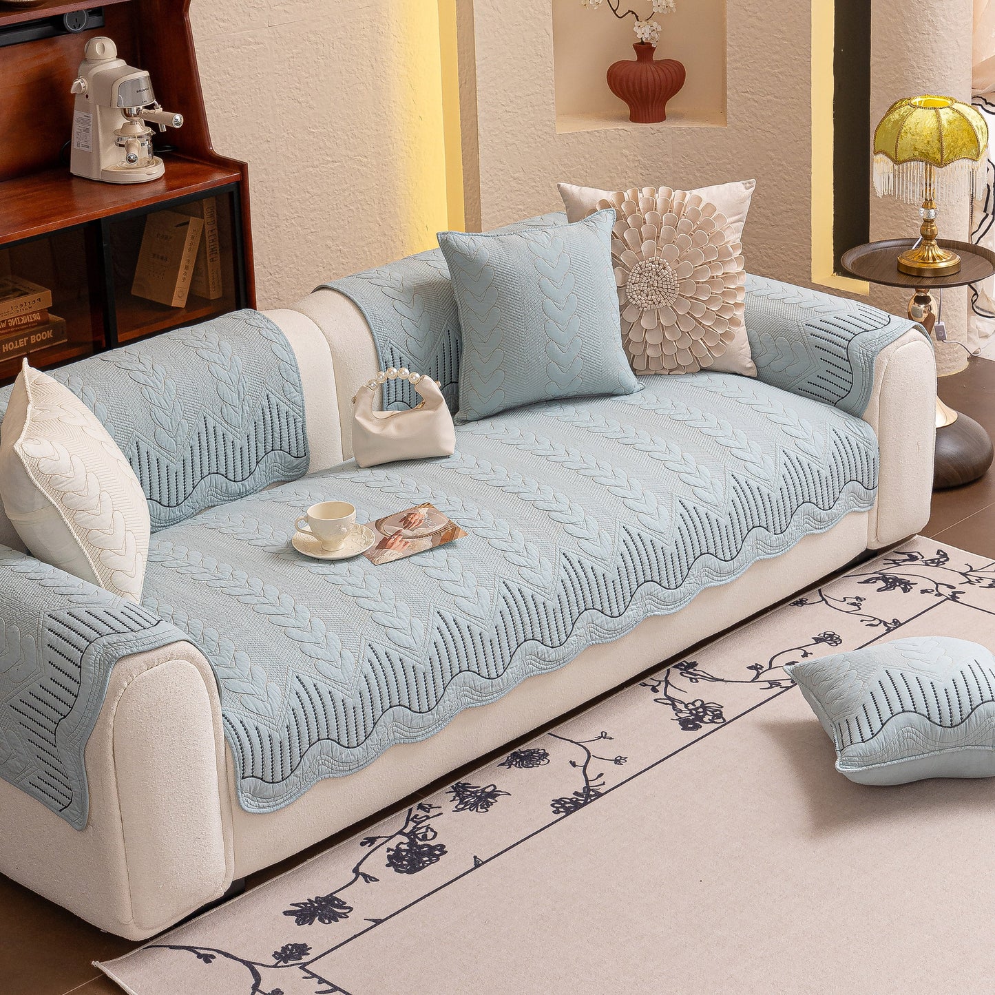 3D Quilted Thick Cotton Sofa Cover Non-Slip Couch Throw for Fabric & Leather Sofas on a white couch in a cozy living room.