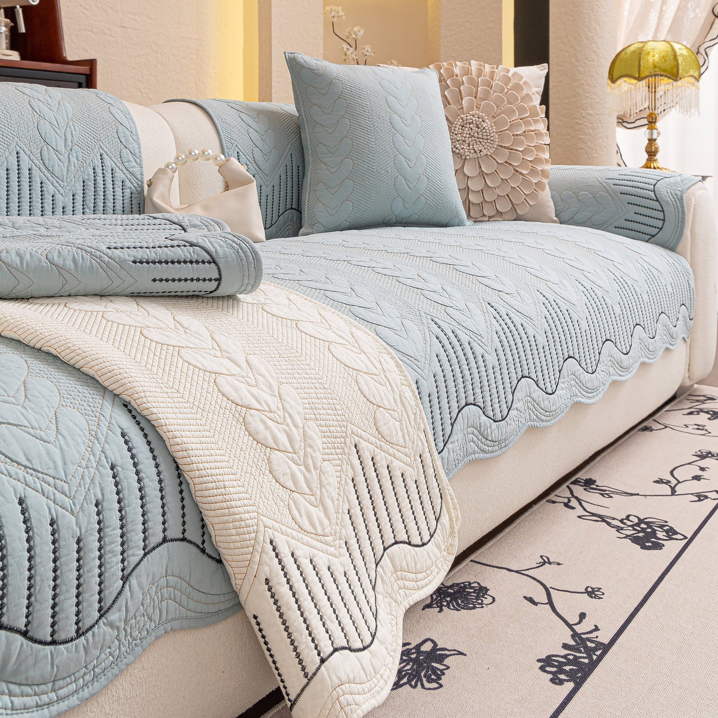 3D Quilted Thick Cotton Sofa Cover Non-Slip Couch Throw for Fabric & Leather Sofas in blue and white on a living room couch.