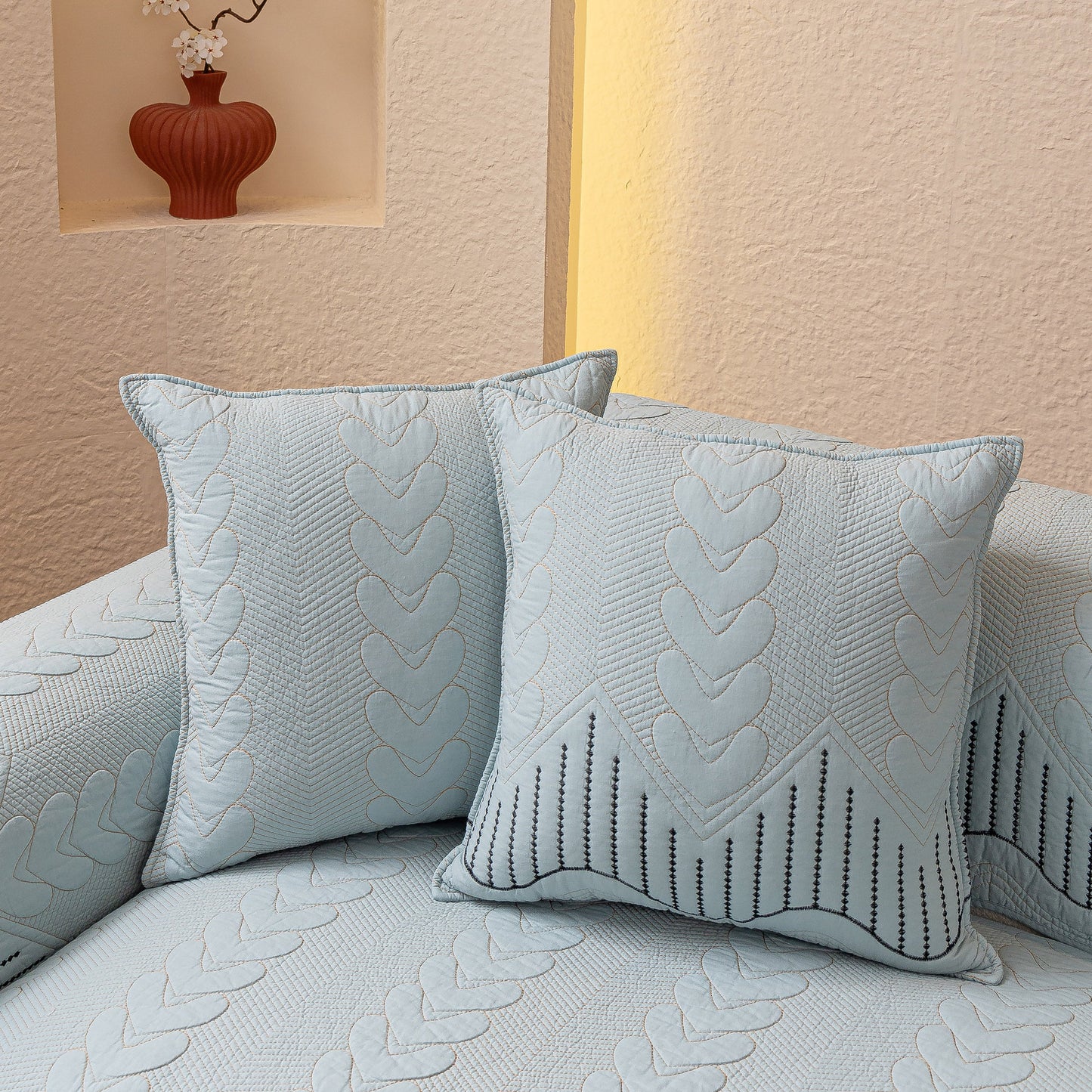 3D Quilted Thick Cotton Sofa Cover Non-Slip Couch Throw for Fabric & Leather Sofas on a couch with matching cushions.