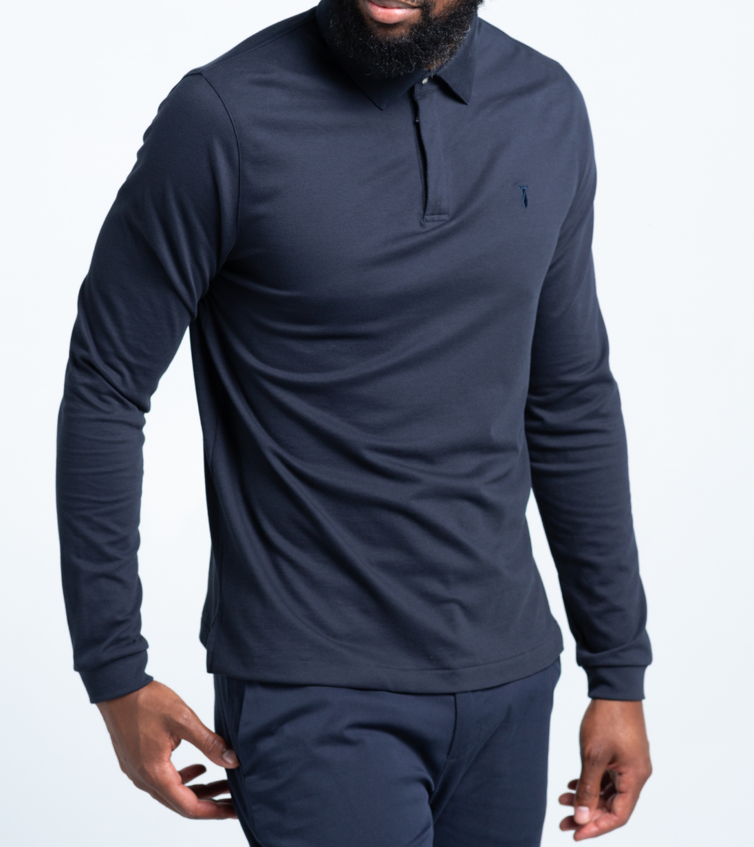Model wearing Long Sleeve Perfect Polo with StaySharp™ Collar, showcasing tailored fit, wrinkle-free fabric, and hidden microfiber cloth.