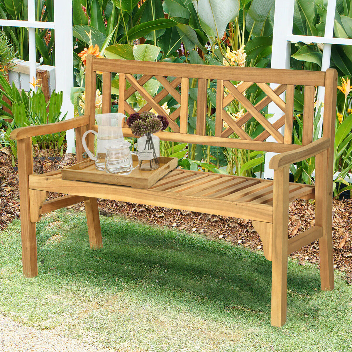 Patio Foldable Bench with Curved Backrest and Armrest made of acacia wood on garden lawn