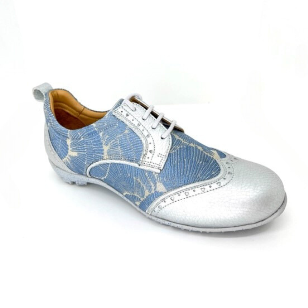 WesTees Grace shoe with artistic blue and silver lace design, featuring a removable cork insole and foam ankle cushioning.