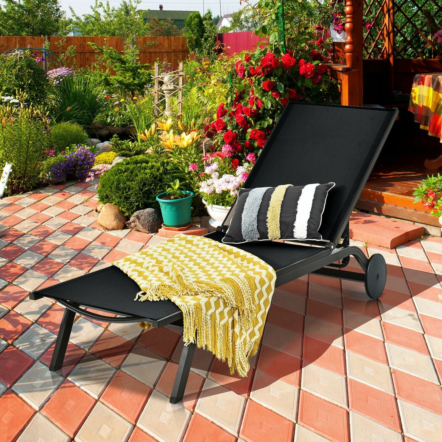 Aluminum Fabric Outdoor Patio Lounge Chair with Adjustable Reclining -Black on garden patio, sunny day setup with cushions.