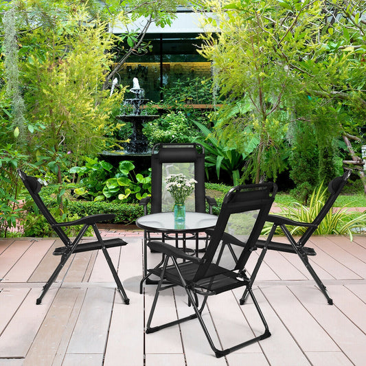 4 Pieces Patio Garden Adjustable Reclining Folding Chairs with Headrest-Black set on a wooden deck in a garden setting