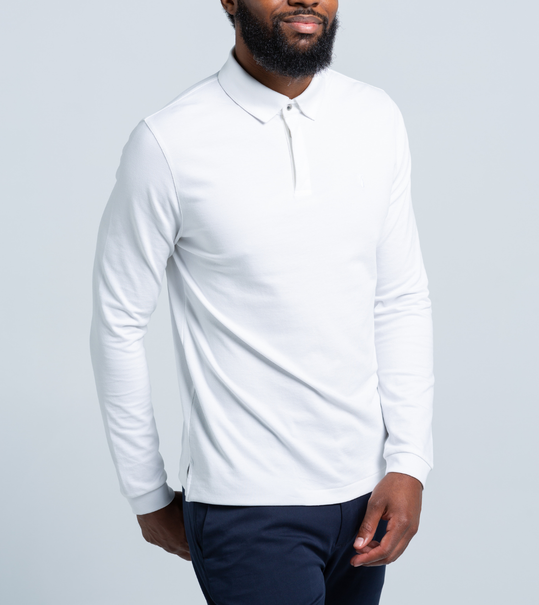 Man wearing Long Sleeve Perfect Polo with StaySharp™ Collar and hidden microfiber cloth, ideal for cooler days.