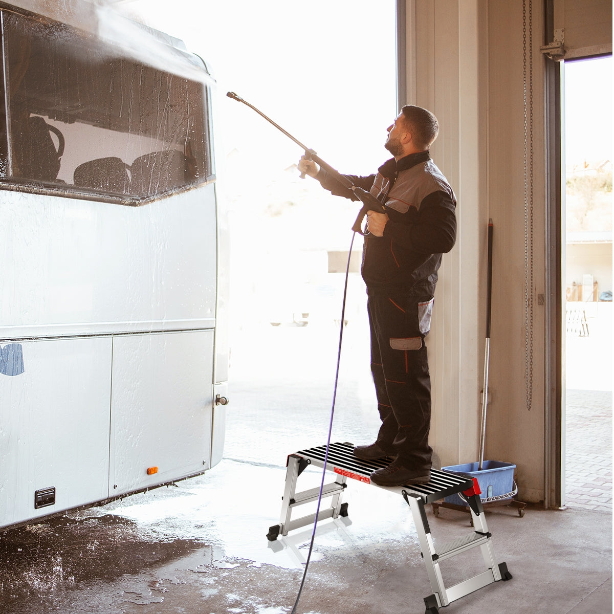 Man washing vehicle using 330 lbs Aluminum Folding Non-slip Drywall Step Stool Ladder in garage