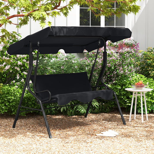 3 Seat Outdoor Patio Canopy Swing with Cushioned Steel Frame-Black in garden setting with plants and decorative table