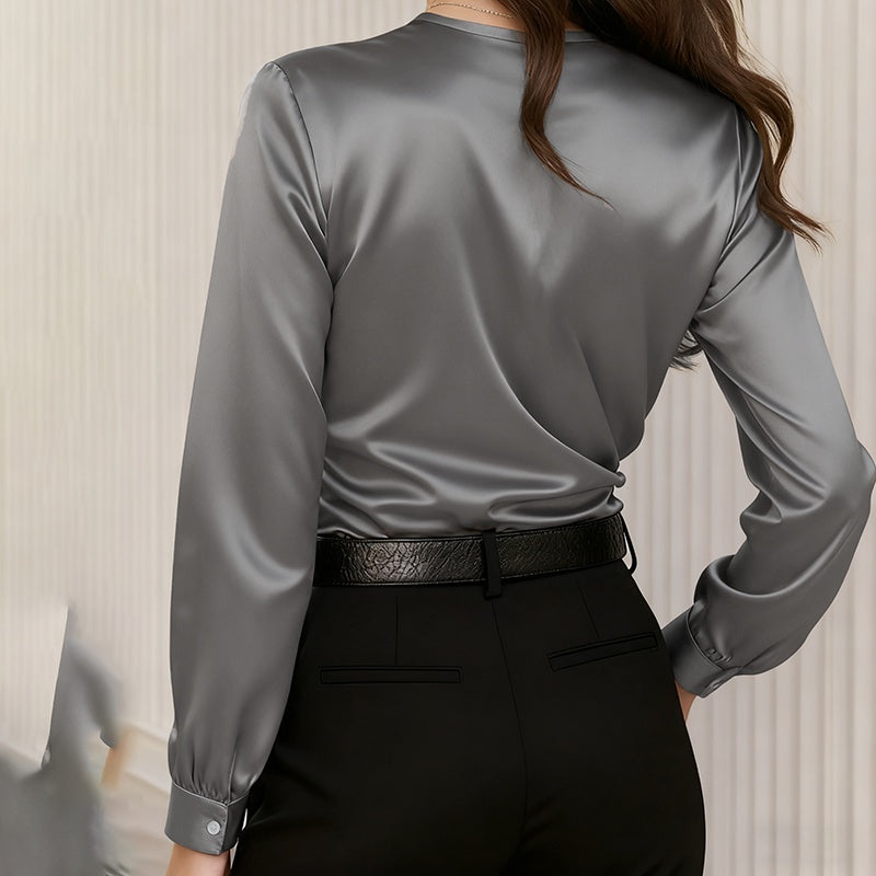 Back view of Women's Elegant Cross V-Neck Blouse, Ruffle Detail Button Accent Office Shirt in gray satin fabric