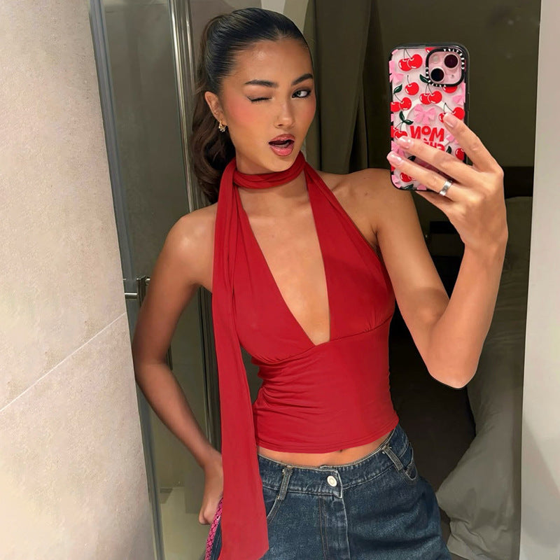 Woman in mirror wearing Women's Scarf Lace-Up Low-Cut Back Cutout Sling Top in red, stylish and chic design.