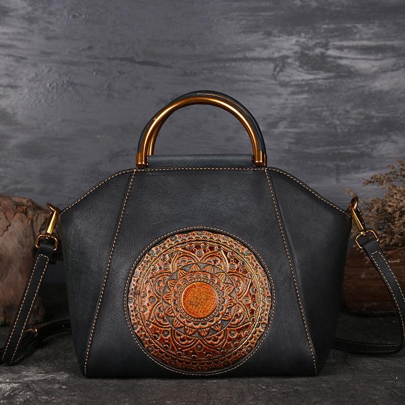 Mandala Embossed Leather Shoulder Bag with intricate mandala design and leather-wrapped handle, showcasing elegant craftsmanship.