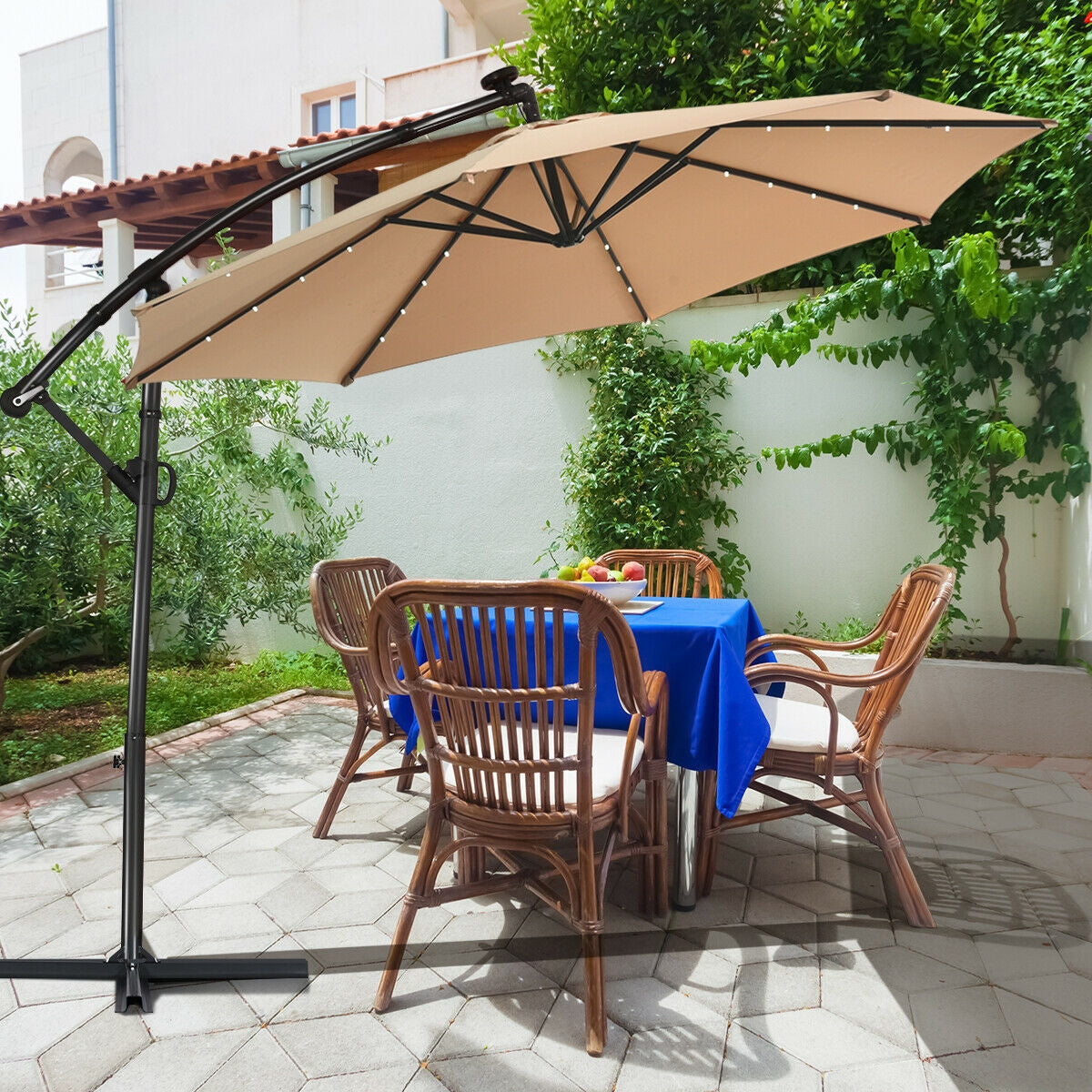 10 ft 360° Rotation Solar Powered LED Patio Offset Umbrella without Weight Base-Beige shading a patio table with chairs
