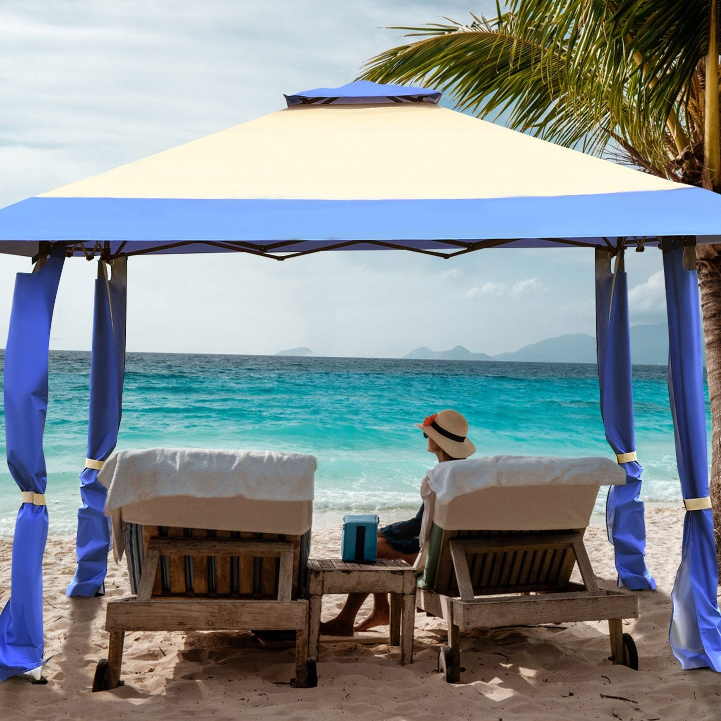 13 Feet x 13 Feet Pop Up Canopy Tent Instant Outdoor Folding Canopy Shelter-Blue on a beach with two lounge chairs under it.
