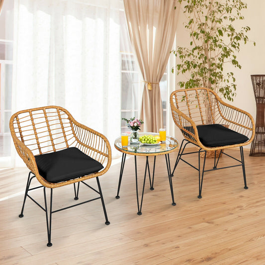 3 Pieces Rattan Furniture Set with Cushioned Chair Table-Black in a bright room, featuring premium wicker chairs and a glass table, perfect for decor.