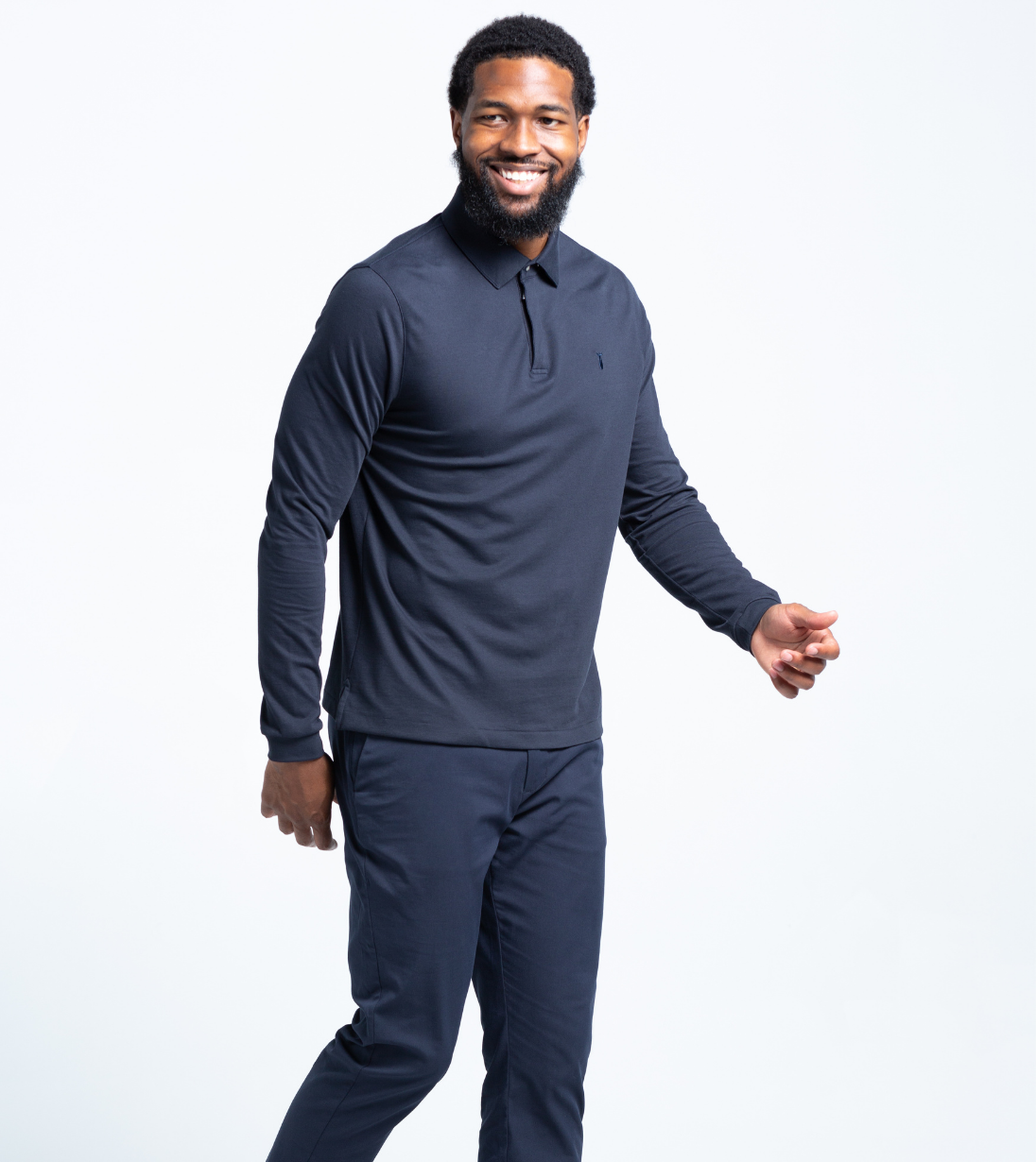 Long Sleeve Perfect Polo in navy, featuring StaySharp™ Collar and hidden microfiber cloth, worn by a man for tailored fit and comfort.