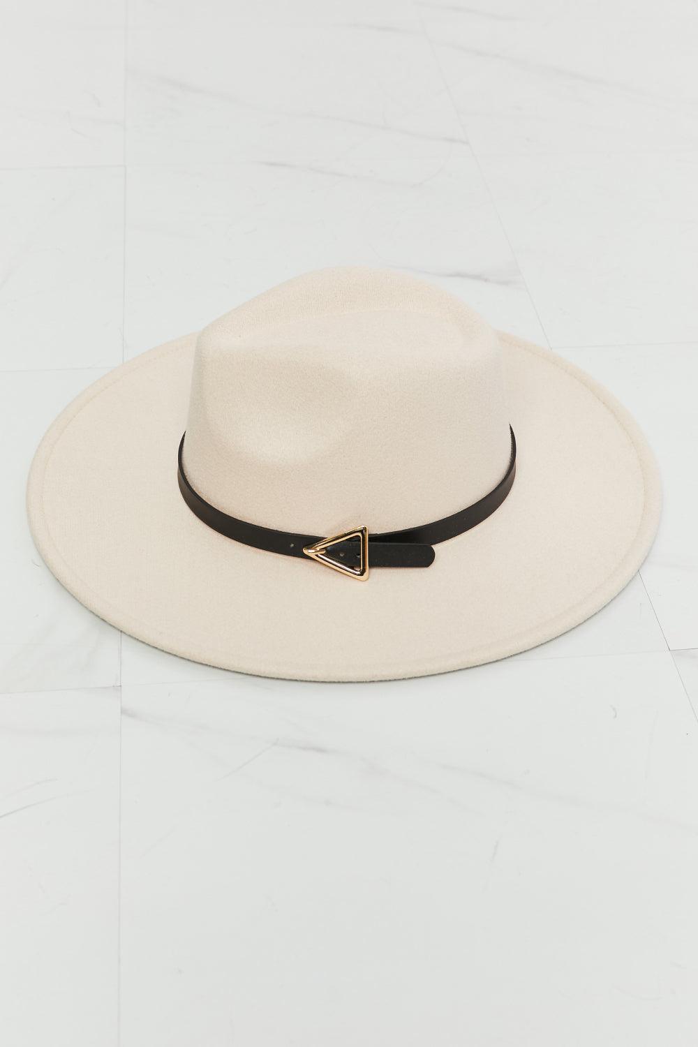 Savannah Sunset Hat - Beige Fedora with black belt and triangle-shaped gold buckle on marble surface