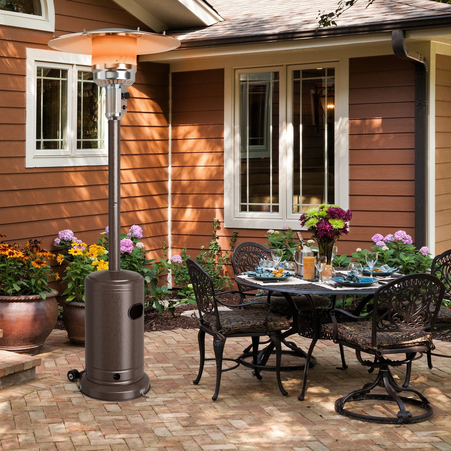 50000 BTU Garden Propane Standing LP Gas Steel Accessories Heater-Bronze on patio next to outdoor dining set