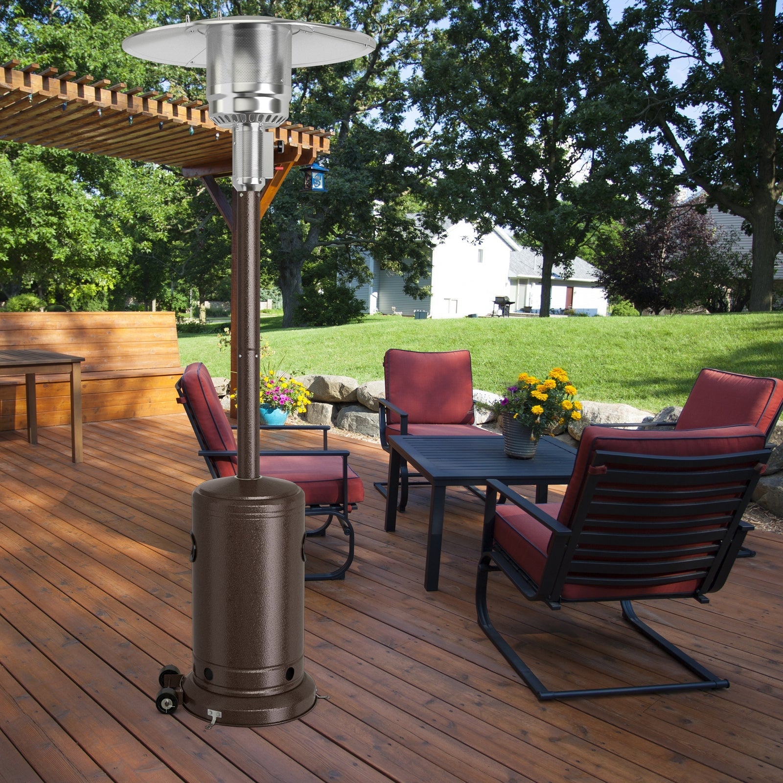 50000 BTU Garden Propane Standing LP Gas Steel Accessories Heater-Bronze on a wooden deck with red patio furniture