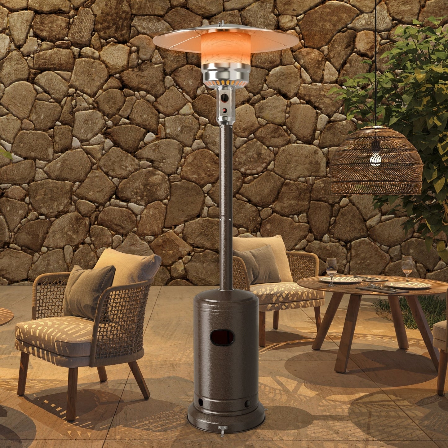 Bronze 50000 BTU Garden Propane Standing LP Gas Steel Accessories Heater on patio with chairs and table.