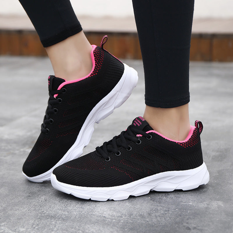 Black and pink Women’s Mesh Running & Travel Sneakers with breathable mesh uppers and cushioned soles for comfort and style.