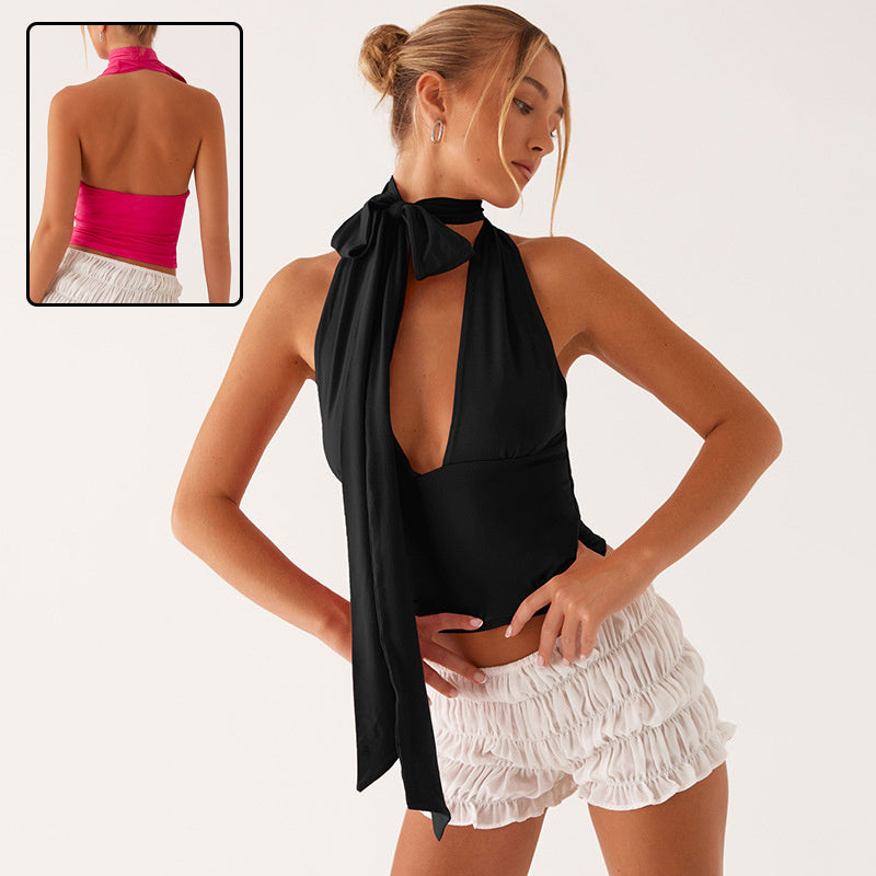 Woman modeling Women's Scarf Lace-Up Low-Cut Back Cutout Sling Top with elegant scarf design and low-cut back, paired with white shorts.