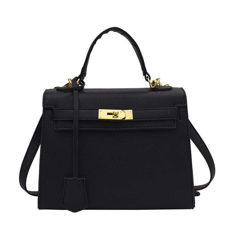 Luxury Cowgirl Kelly Purse – Trendy, High-Fashion Leather Handbag with Adjustable Strap in black with buckle lock design.