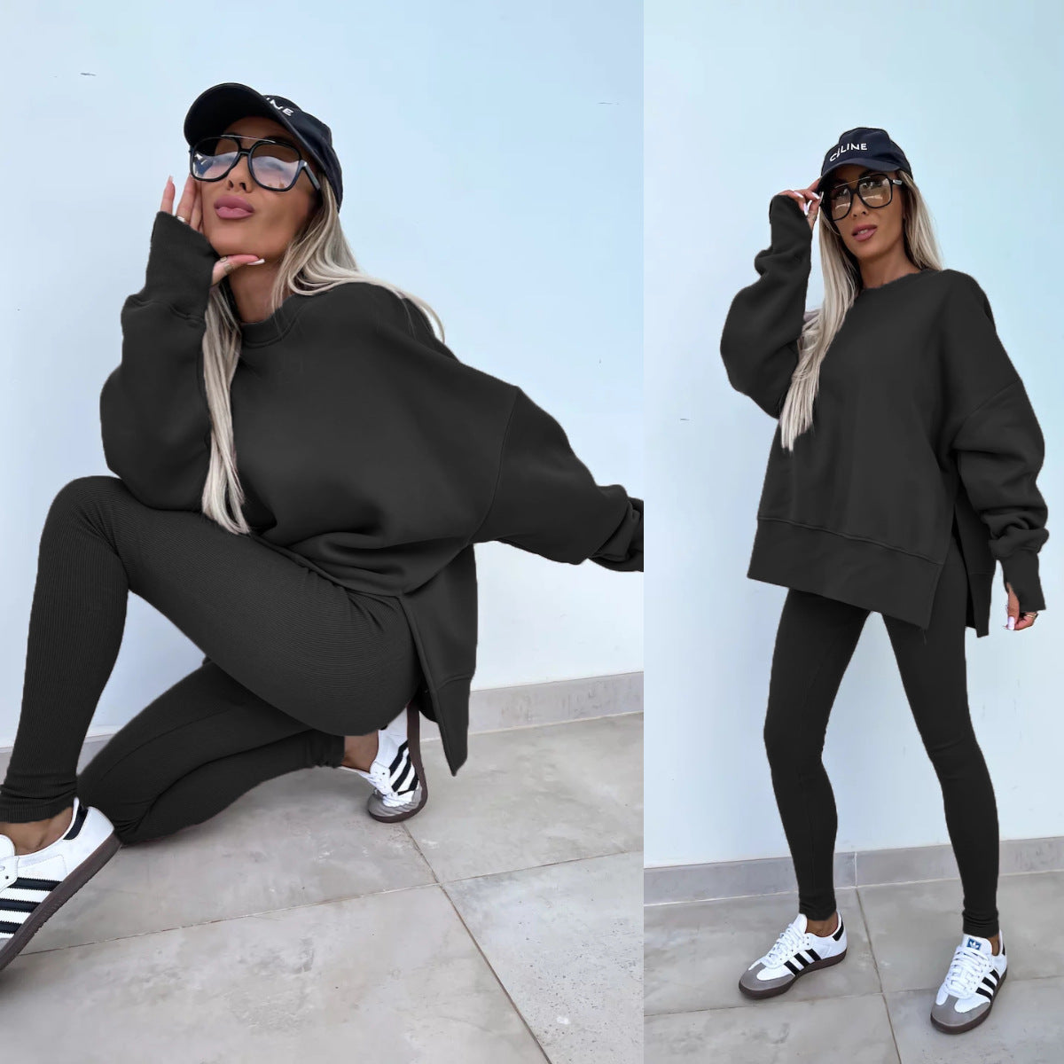 Woman wearing Women's Casual Sweater Suit - Loose Split Top & Fitted Trousers Set in black, styled with casual sneakers and cap.