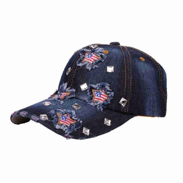 American Flag Distressed Denim Baseball Cap with star embroidery and rhinestone embellishments, featuring rugged denim and American flag design.