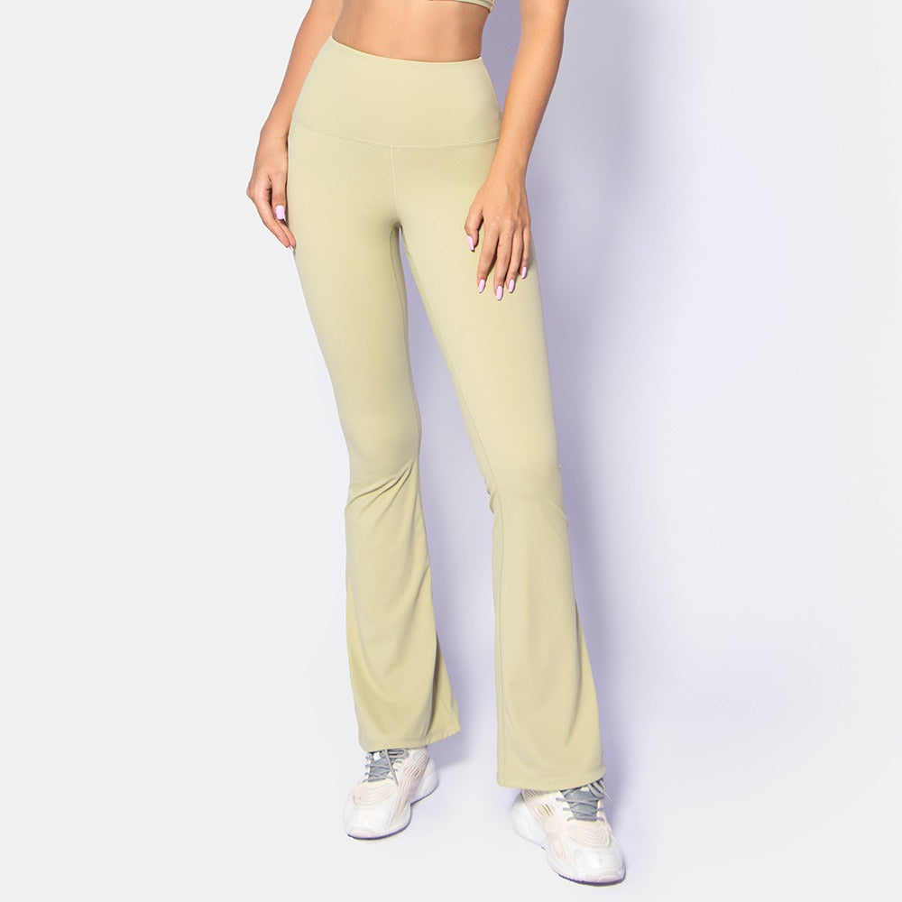 Woman wearing Cloud Sense Wide Leg Pants, ideal for yoga, fitness, and running; features breathable, flexible nylon fabric in beige color.