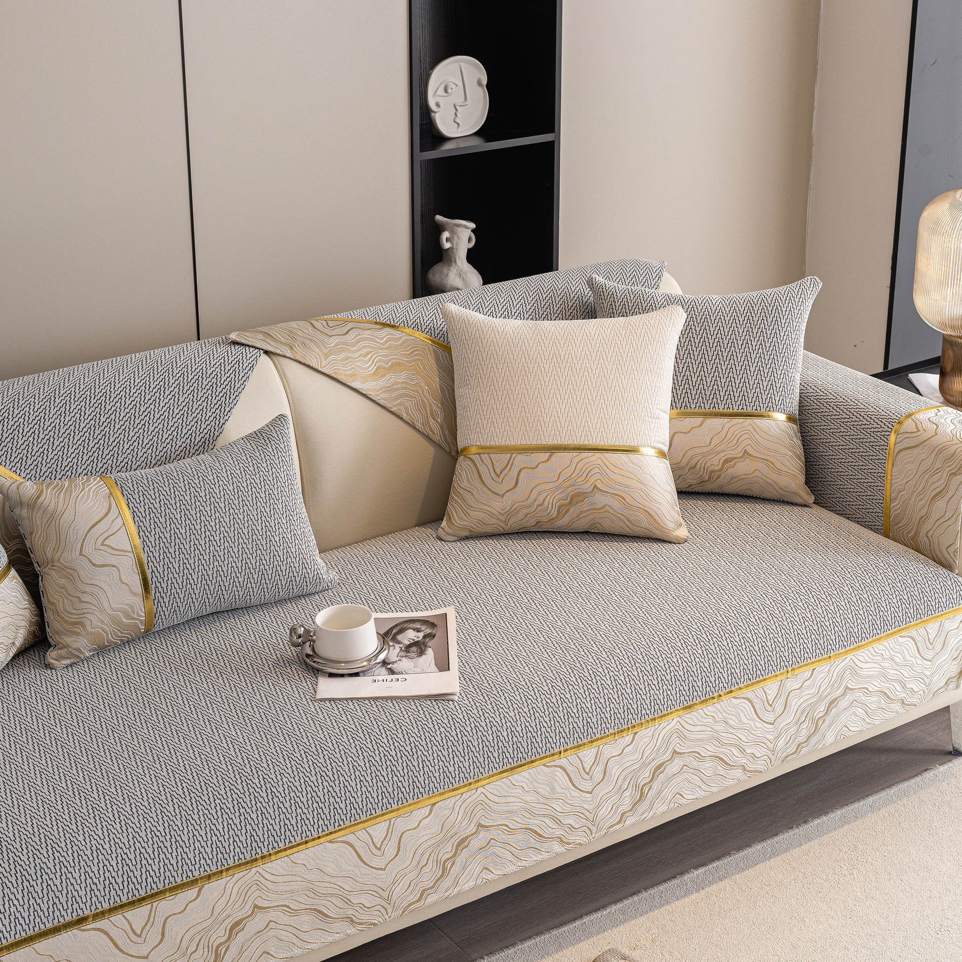 Non-Slip Couch Cover with Gold Trim on a modern sectional sofa, featuring chenille and anti-slip dots, by SlipcoverKAS.