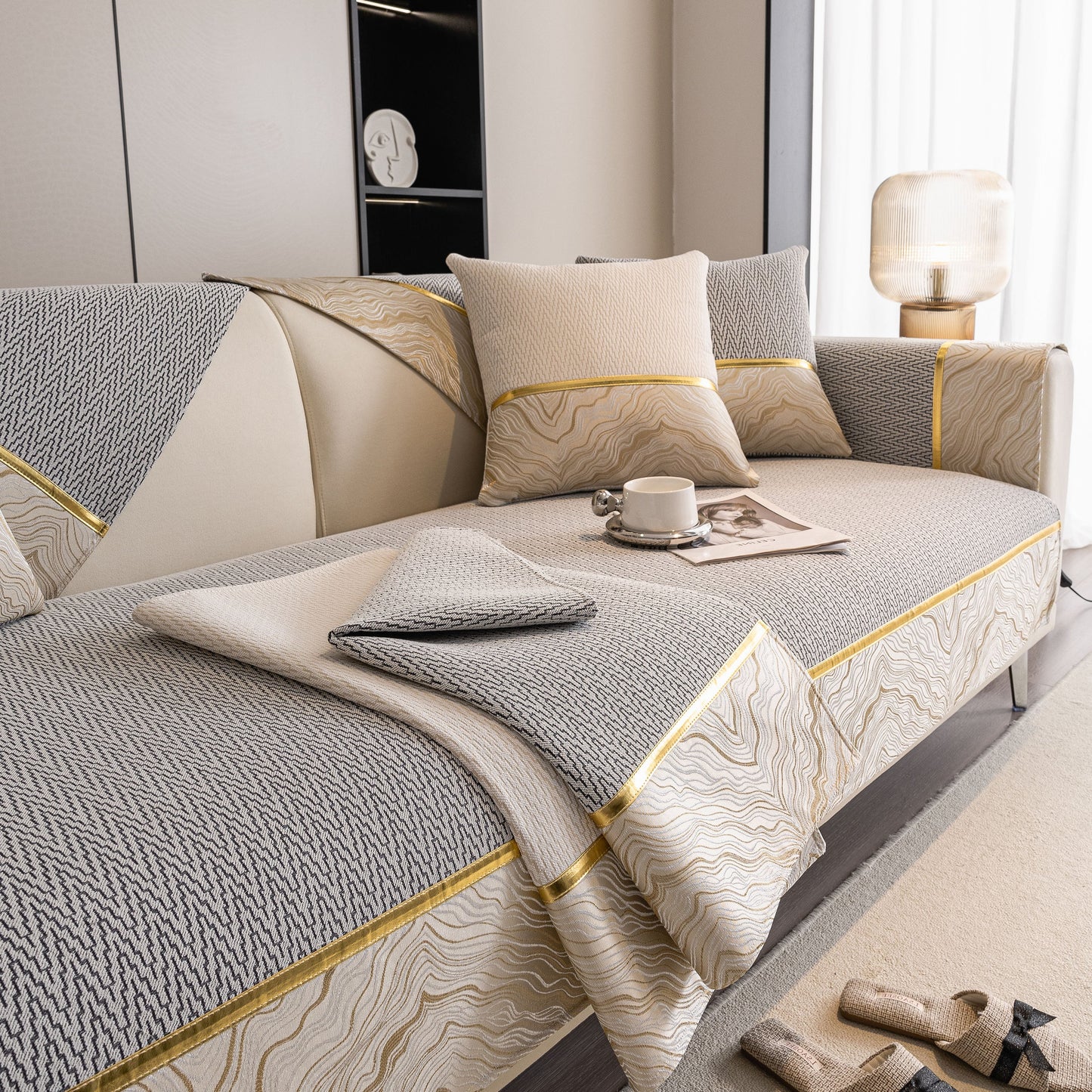 Non-Slip Couch Cover with Gold Trim, Sofa Slipcover for Sectional & Loveseat on modern sofa with coffee cup.