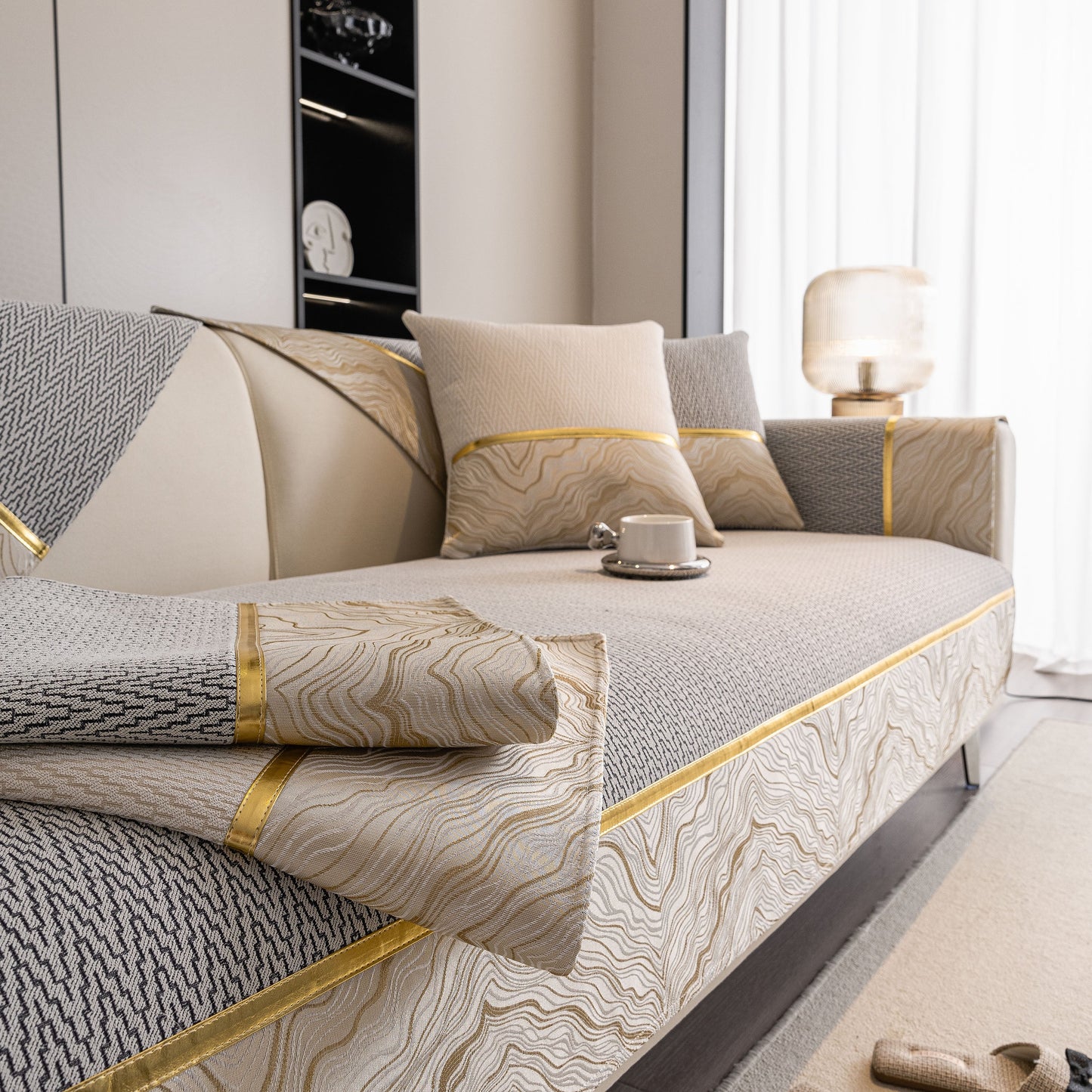 Non-Slip Couch Cover with Gold Trim, Sofa Slipcover for Sectional & Loveseat in chenille with dual-pattern design on a sofa.