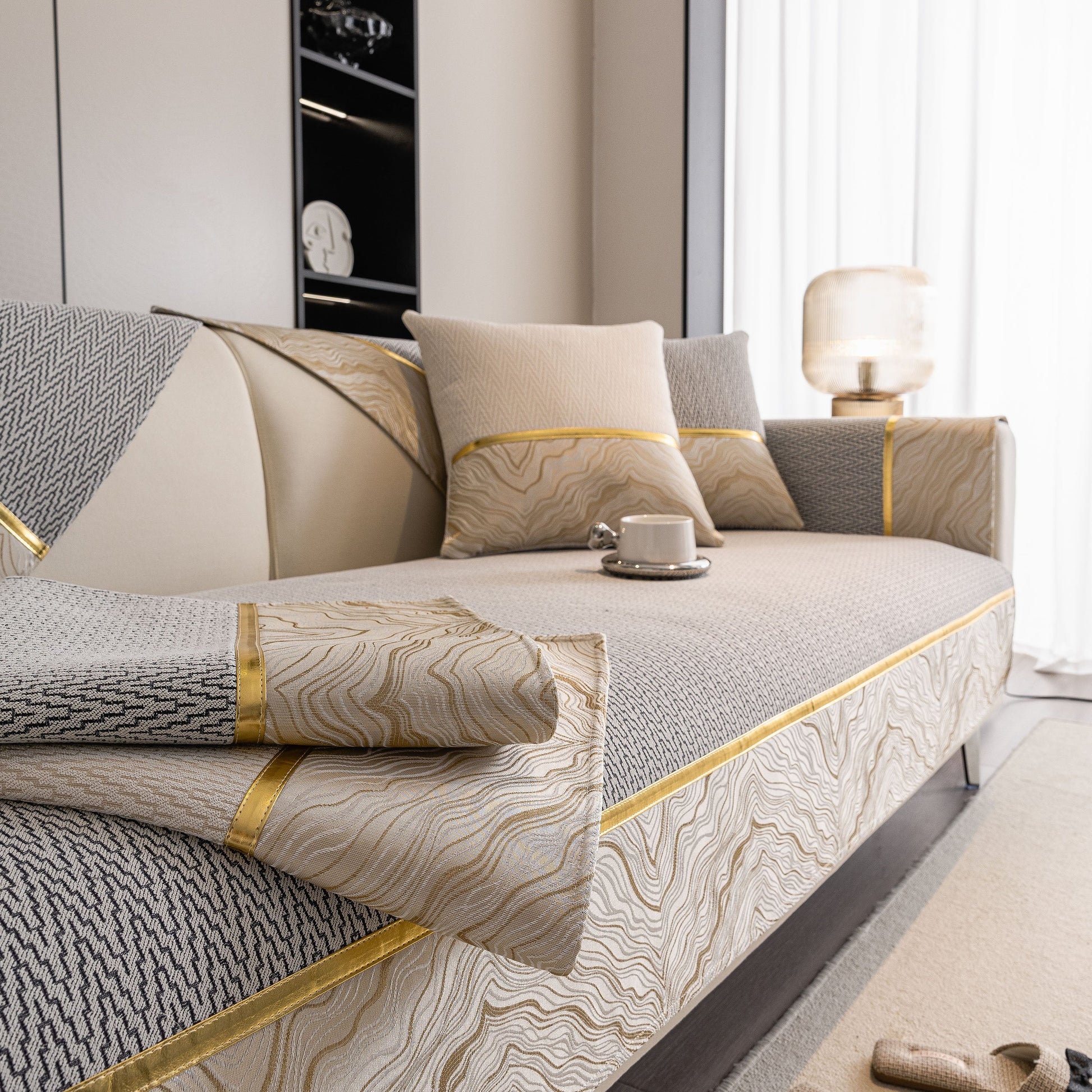 Non-Slip Couch Cover with Gold Trim, Sofa Slipcover for Sectional & Loveseat in chenille with dual-pattern design on a sofa.