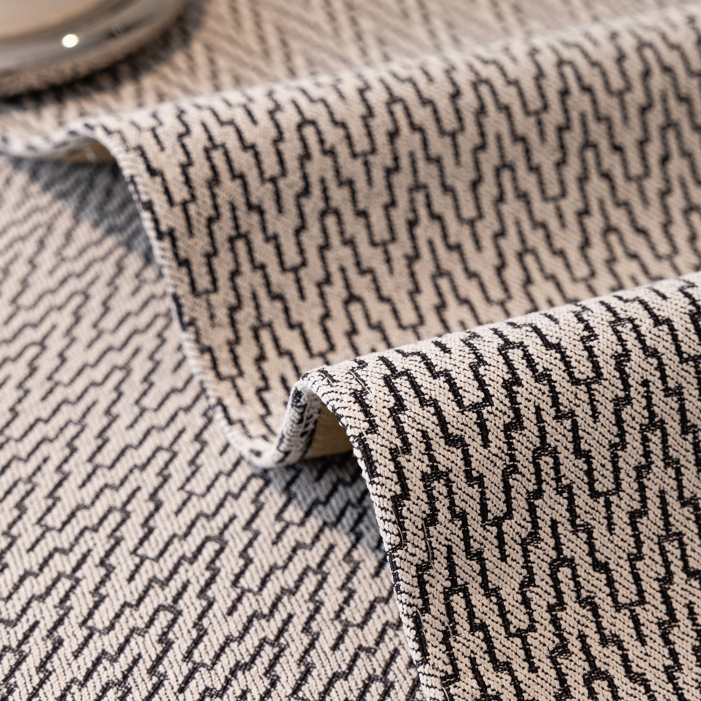 Close-up of chenille fabric from Non-Slip Couch Cover with Gold Trim, featuring chevron design and anti-slip coating.