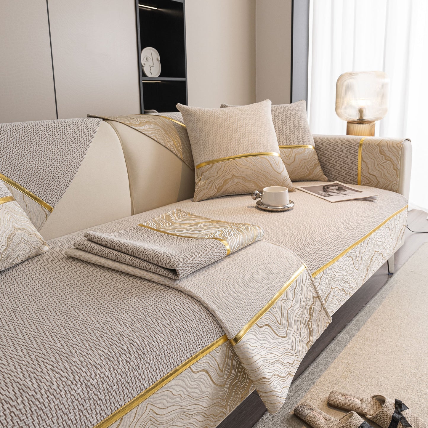 Non-Slip Couch Cover with Gold Trim, Sofa Slipcover for Sectional & Loveseat on a modern sofa with chenille and anti-slip design.