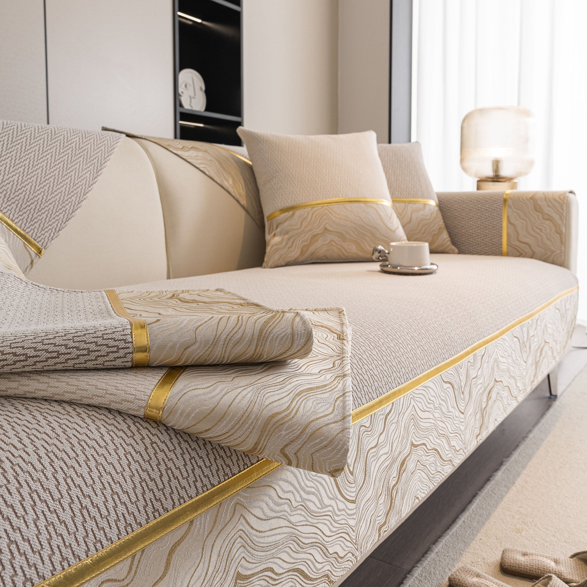 Non-Slip Couch Cover with Gold Trim on a sectional sofa, featuring chenille fabric and anti-slip silicone dots.