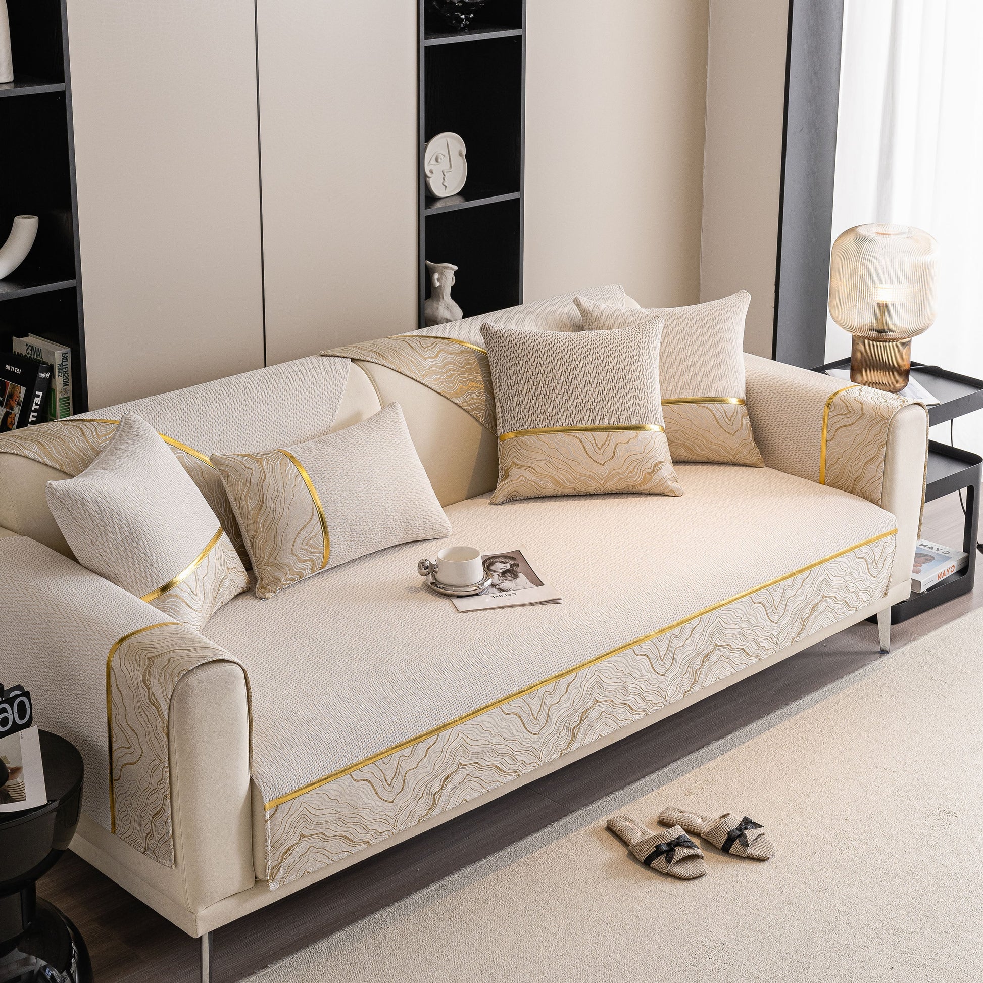 Non-Slip Couch Cover with Gold Trim on sectional sofa in modern living room.