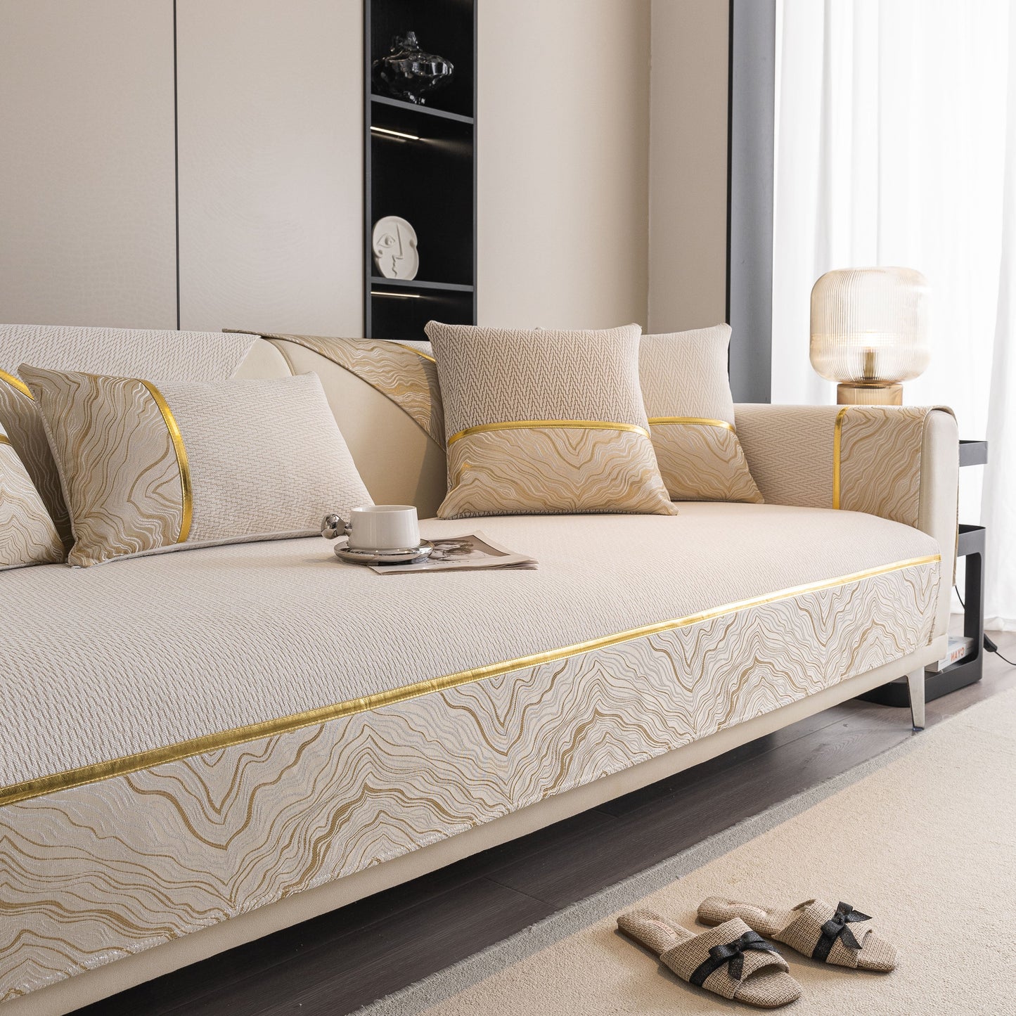 Non-Slip Couch Cover with Gold Trim, Sofa Slipcover for Sectional & Loveseat on chic couch with pillows and cup.