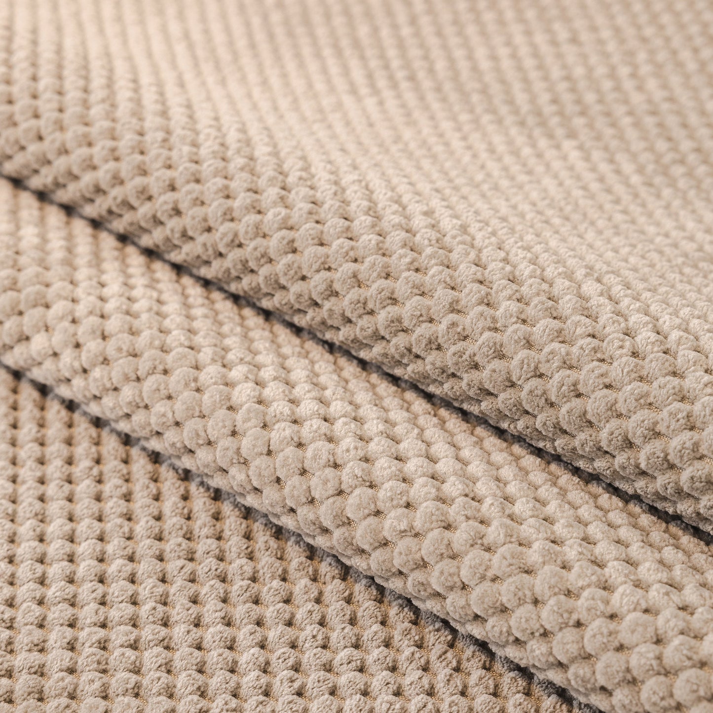 Textured beige fabric of Dog Washable Sofa Protector Cover, Non-Slip Couch Slipcover with Soft Furry Trim.